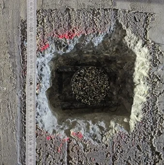 Installed sensor in a drilled hole next to the reinforcement