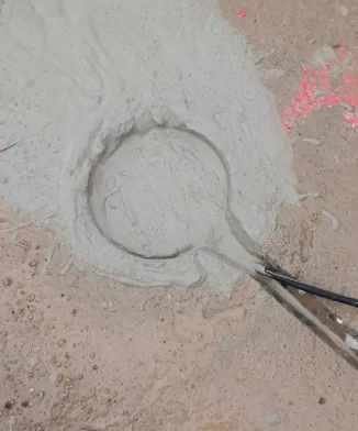 Sensor embedded in fresh mortar, with connecting cable