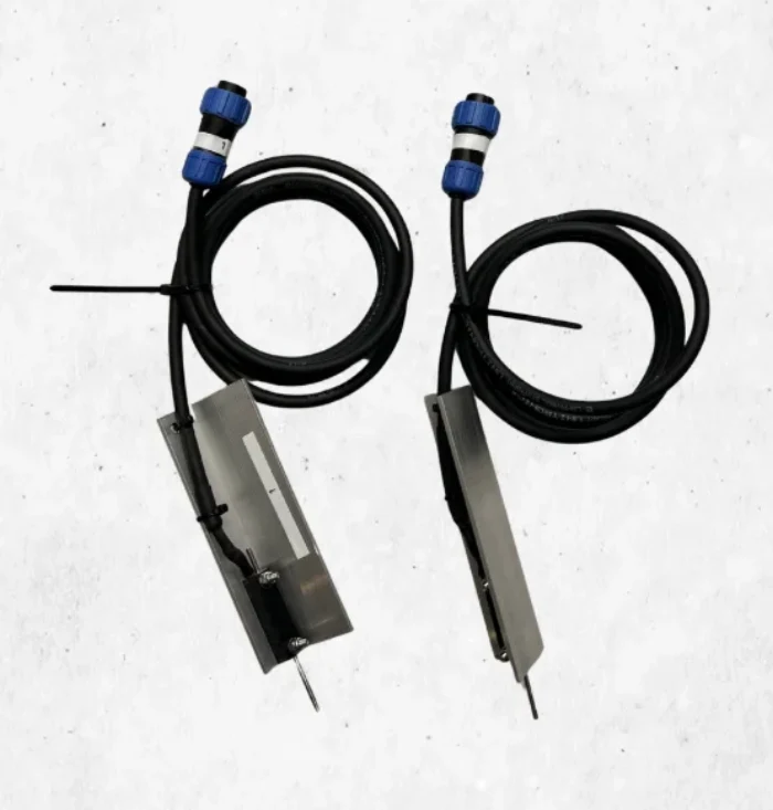 Two linear displacement transducers with connecting cable and plug connector
