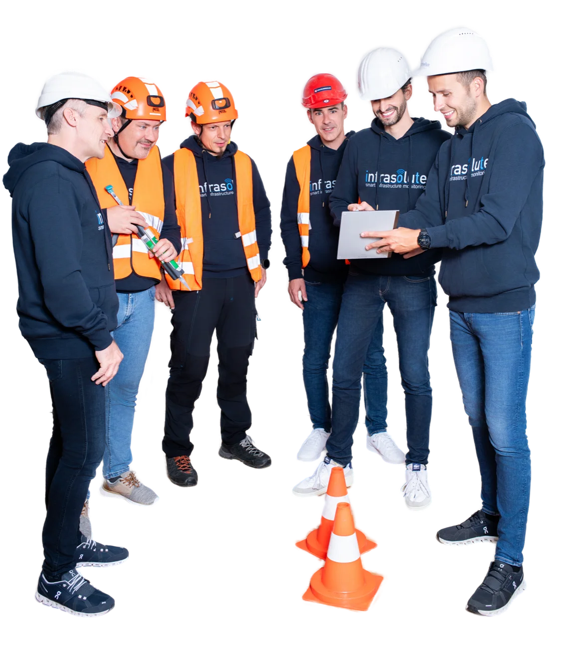 Six Infrasolute employees in hard hats and hi-vis vests discussing readings on a tablet